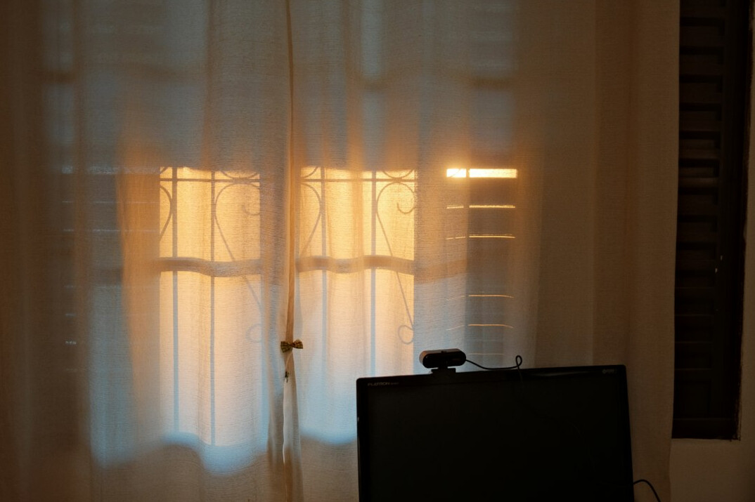 Source code displayed on a dark monitor in an office
